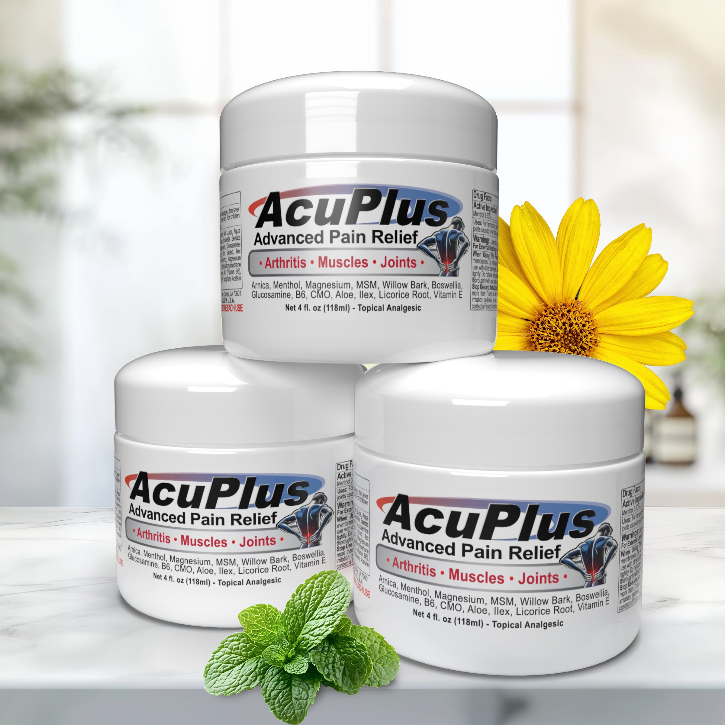 Three jars of AcuPlus Advanced Pain Relief cream with a yellow arnica flower and mint leaves on a blurred background.